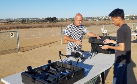 Sweetwater UAS students Armando Garcia and Ellejon Hernandez perform flight training at the Silent Electric Flyers Club in Mission Bay.